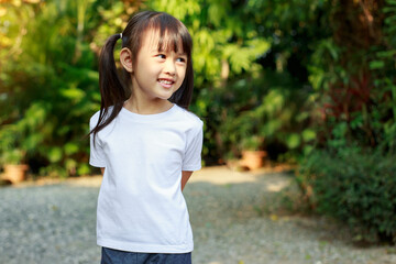 Portrait of cute girl with empty space of white t-shirt which good for mockup
