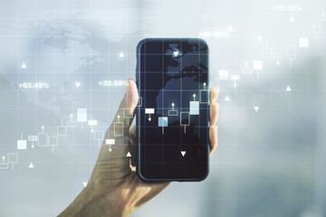 Multi exposure of abstract creative financial graph with world map and hand with phone on background, forex and investment concept