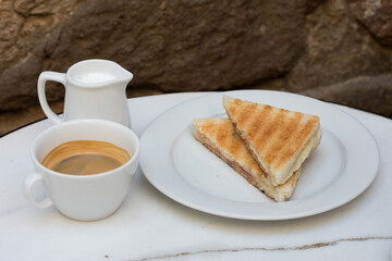 Toasted sandwich served with coffee