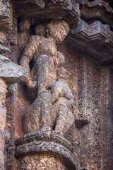 Erotic statues of couples making love in the 800 year old Sun Temple Complex, Konark, India. Kamasutra postures in Hindu Indian Temples. UNESCO World Heritage Site.