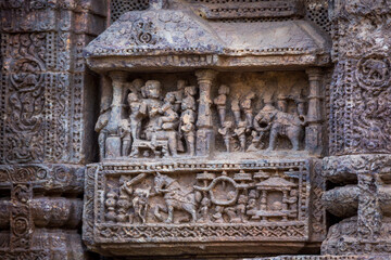 Figures of King and his consorts along with the royal court and elephant in the ruins of 800 year old Sun Temple Complex, Konark, India.  Unesco World Heritage  Site.