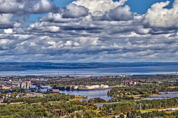 Fototapeta na wymiar Ports, factories, roads , hills, and the Lake Superior under the clouds - Thunder Bay, Ontario, Canada
