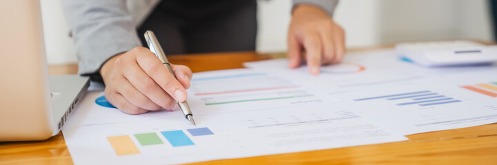 Business Professional Accountant Woman working on laptop computer making research for planning startup at desktop working process in office