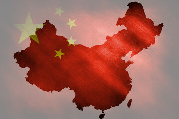 The outline of the Chinese border in the national colors on a grunge background