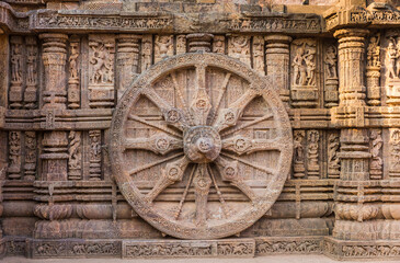 A stone wheel engraved in the walls of the 800 year old Sun Temple, Konark, India. The temple is designed as a chariot consisting of 24 such wheels.