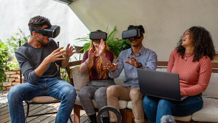 group of young friends experiencing virtual reality with headset, one woman piloting the AR, experienced influencers and players trying a new virtual game, podcasting streaming