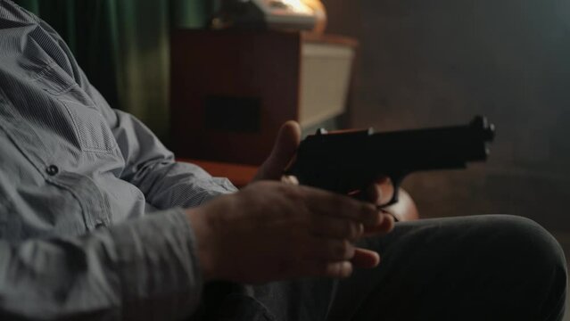 Special secret agent is reloading pistol gun. Spying or intelligence gathering. Espionage concept.