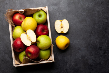 Fototapeta na wymiar Colorful ripe apple fruits in box