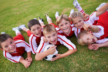 The field holds promise. Shot of a childrens soccer team. © Mikolette Moller/peopleimages.com