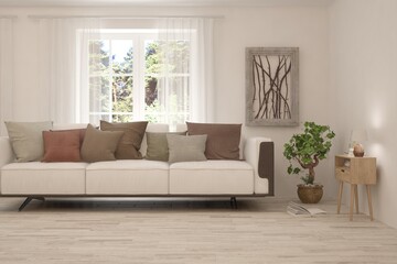 Fototapeta premium Minimalist living room in white color with sofa and summer landscape in window. Scandinavian interior design. 3D illustration