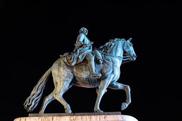 Sculpture of a mounted knight in a square in Madrid