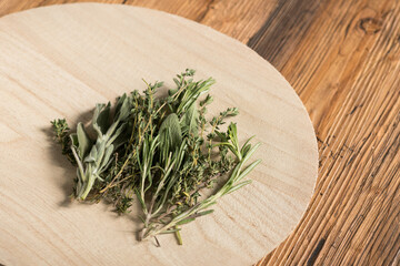 Various herbs on rustic table