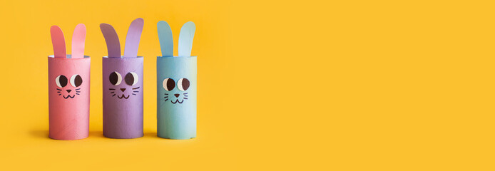 Holiday easy DIY craft idea for kids. Toilet paper roll tube toy's cute rabbit's on yellow...