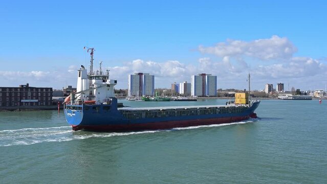 A German registered cargo ship entering Portsmouth Harbour from with Gosport in the background.