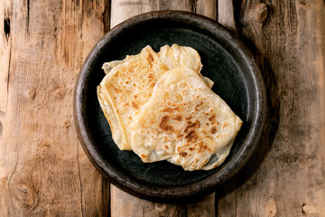 Traditional indian homemade roti flatbread in ceramic dish