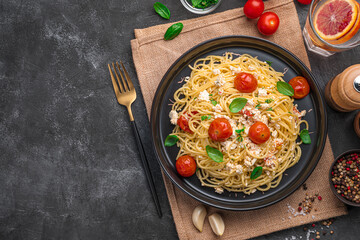 A popular recipe for pasta with feta made from cherry tomatoes, feta cheese, garlic and herbs.