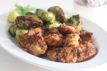 Green and red chicken kababs. Boneless chicken cubes marinated and air fried