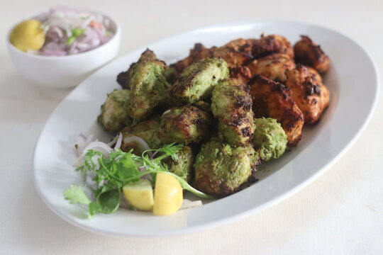 Green and red chicken kababs. Boneless chicken cubes marinated and air fried