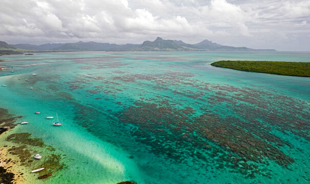 Aerial view of the south-east coast of Mauritius island and Ilot Aigrettes from Pointe d'Esny beach