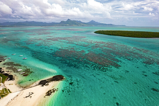 Aerial view of the south-east coast of Mauritius island and Ilot Aigrettes from Pointe d'Esny beach