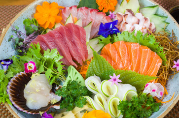 Platter decorated with different flavors of elegant sushi.