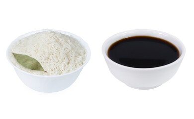 Rice and soy sauce on an isolated white background. Rice and soy sauce in a bowl