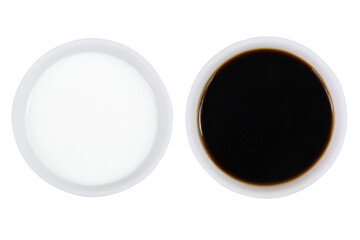 Milk and soy sauce on isolated white background