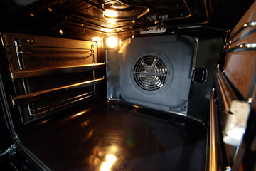 Oven interior with forced draft fan and lighting