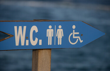 wc sign with wheelchair symbol