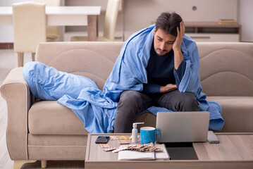 Young man feeling bad at home