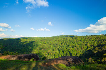 green mountains and daytime sky,Sky blue or azure sky and cloud overcast on mountain or hill is beautiful on daytime. Green tree forest or woods on mountain view beauty. Tourist travel to refresh