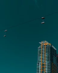 Acrylic prints Green Blue Downtown urban city building skyline with shoes on telephone line San Diego California