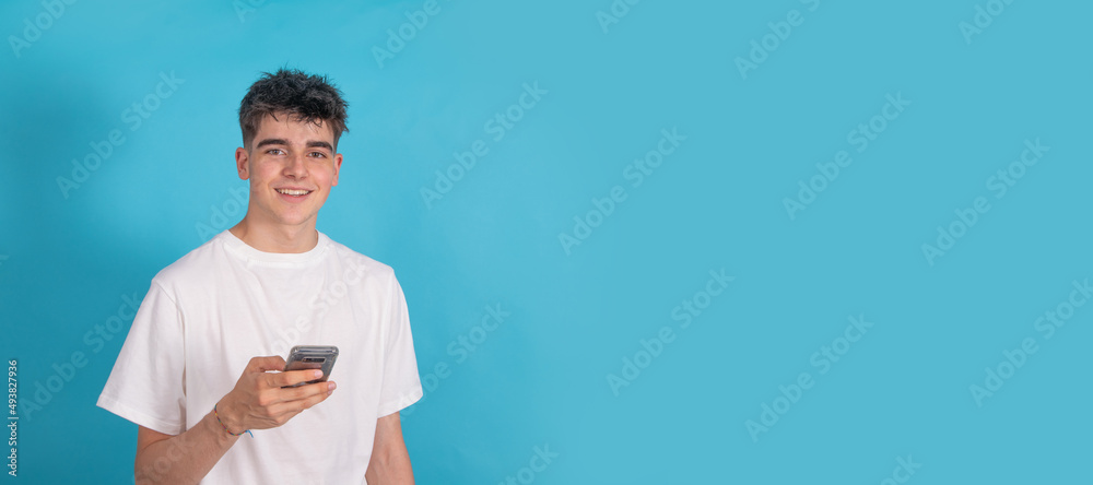 Poster isolated young teenager with mobile phone