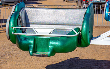 Fiberglass Bucket Seat With Safety Bar On Amusement Ride