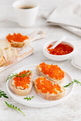 Open sandwiches with red salmon caviar