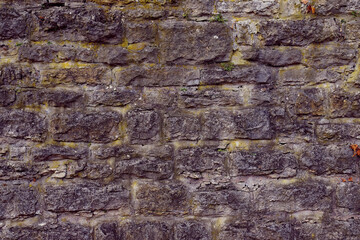 Texture of a stone wall. Old castle stone wall texture background. Stone wall as a background or texture. Part of a stone wall, for background or texture