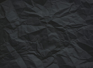 Vintsge crumpled black colored paper for background