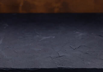 Abstraxt table top background texture.  Black stone tabletop front view
