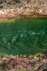 Both Shores Of The Colorado River At The Bottom Of The Grand Canyon