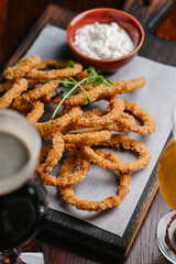 Beer appetizer fried onion rings with tartar sauce