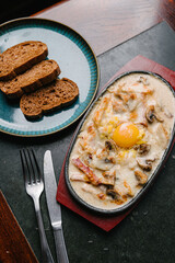 hot skillet with chicken and mushrooms in a creamy sauce