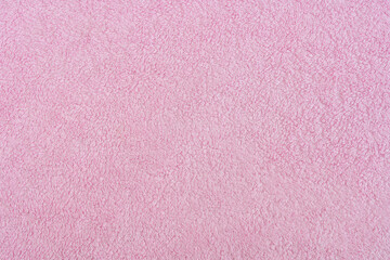 Fototapeta premium Texture of light pink terry cloth close up