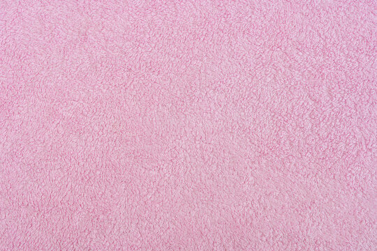 Texture of light pink terry cloth close up
