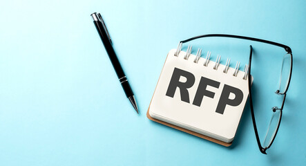 RFP text written on a notepad on the blue background