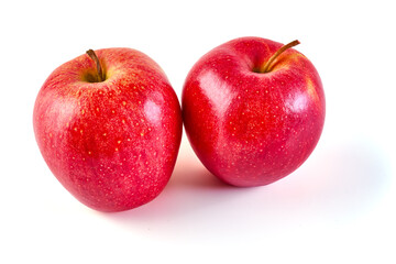 Shiny Red ripe apples, isolated on white background. Fresh raw organic fruits.