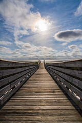 Fototapeta na wymiar Wooden footbridge to Gulf of Mexico