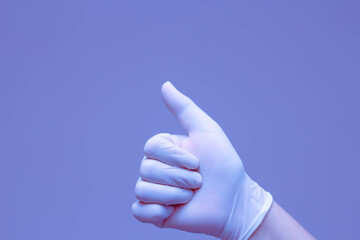 Hands wearing rubber gloves symbolize a "like" with a blue background.