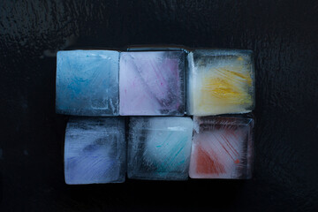 colorful ice cubes on a textured vintage background