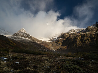 Panorama of Mont Blanc from Italy. Mountain peaks. Snowy mountain peaks after autumn rain, fog and clouds. 