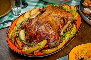 Baked duck with apples on the festive table